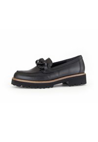 Black leather loafers with a textured bow detail, round toe, and low rubber sole featuring a contrasting brown stitching accent.