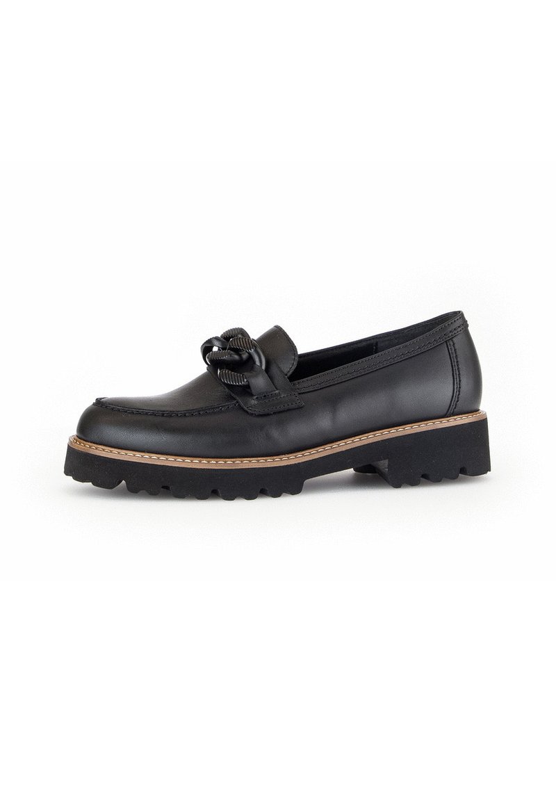 Black leather loafers with a textured bow detail, round toe, and low rubber sole featuring a contrasting brown stitching accent.