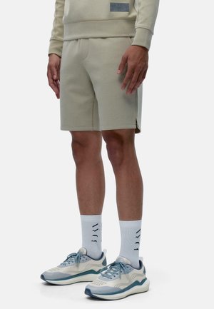 HUGHES - Tracksuit bottoms - beige