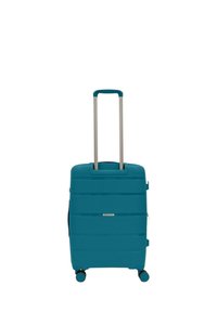 Valigia rigida color teal con superficie testurizzata, manico telescopico argento e quattro ruote blu per la mobilità.