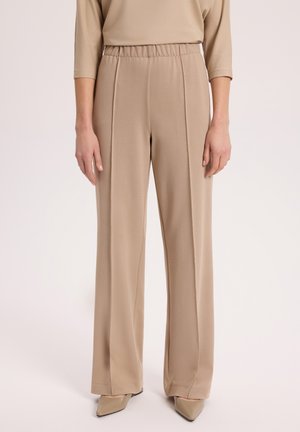 - Spodnie materiałowe