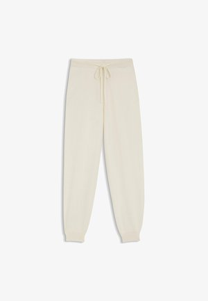 Cremfarbene Jogginghosen aus weichem Stoff, mit einem elastischen Bund und einer Kordel, sowie schmal zulaufenden Bündchen und einfachen Nahtdetails.