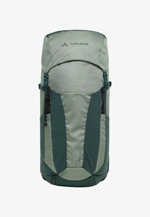 Zaino verde Vaude Brenta 24 con finitura testurizzata, spallacci imbottiti, chiusura superiore, tasche laterali e logo sul fronte.