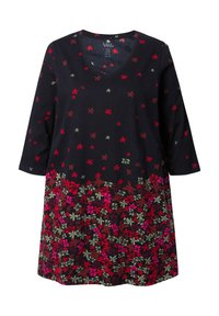 Bloemrijke tuniekjurk met een marineblauwe achtergrond en rode en groene bladdessins, V-hals en driekwart mouwen. Zachte stof.