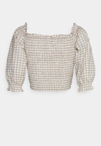 Top crop com pregas e mangas bufantes, apresentando um padrão de xadrez bege e branco. Decote com babados e punhos elásticos.