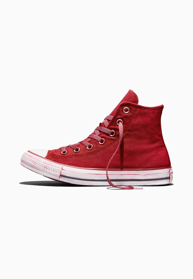 Red high-top canvas sneaker with white rubber sole and toe cap, pink laces partially untied, shown from the outer side on white background.