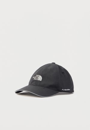 Black North Face baseball cap with curved brim, reflective edge, and "FLASHDRY" text on side, displayed on white background.