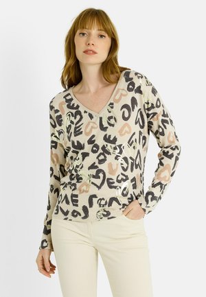 Pull à manches longues en V couleur crème, orné d'un imprimé abstrait multicolore avec des cœurs et des formes ; fabriqué à partir d'un tissu doux et texturé.