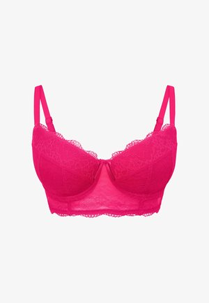 Vaatetuksena on pitsinen rintaliivi kirkkaan vaaleanpunaisena, muotoiltujen kuppeiden, säädettävien olkaimien ja laineilevien reunoiden kanssa. Ominaisuuksiin kuuluu sileä tekstuuri ja kevyt rakenne.