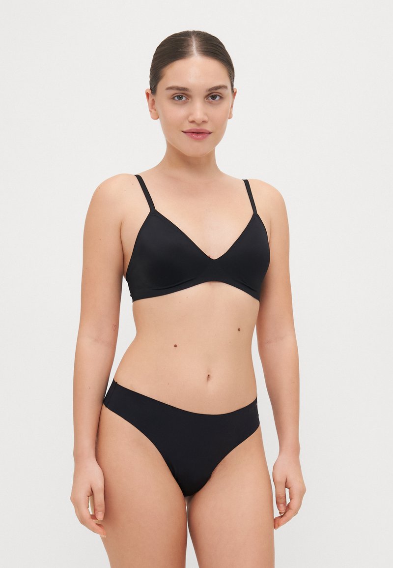 Black bikini set featuring a triangular bralette with thin straps and a matching low-rise bottom, crafted from smooth, stretchy material.