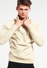 Urban Classics ACID WASH RAGLAN HOODY - Luvtröja - sand