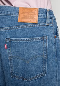 Levi's® STAY BAGGY TAPER - Calças de ganga de corte relaxado - love games