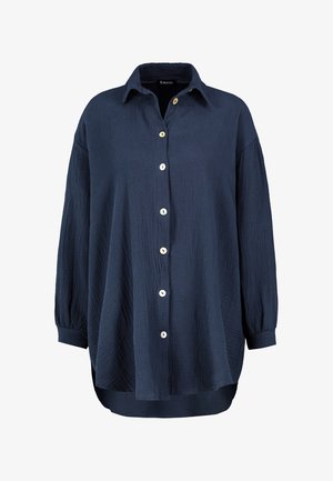 Navy blue button-up shirt made from textured fabric. Features a collar, long sleeves with buttoned cuffs, and contrasting buttons.