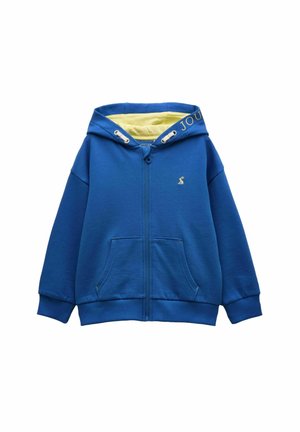 Blå hættetrøje med lynlås, forlommer, gul hættelining, snore og lille broderet logo på venstre bryst.
