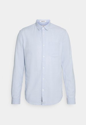 Helles blaues Longsleeve-Hemd aus Leinen. Verfügt über einen Button-Down-Kragen, eine Brusttasche und eine subtile Textur. Klassische Passform mit abgerundetem Saum.