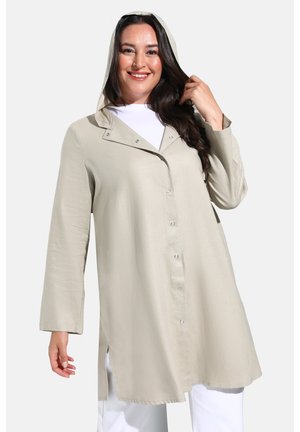Light beige hooded jacket made of a smooth fabric. Features a button-up front, long sleeves, and side slits for added comfort.