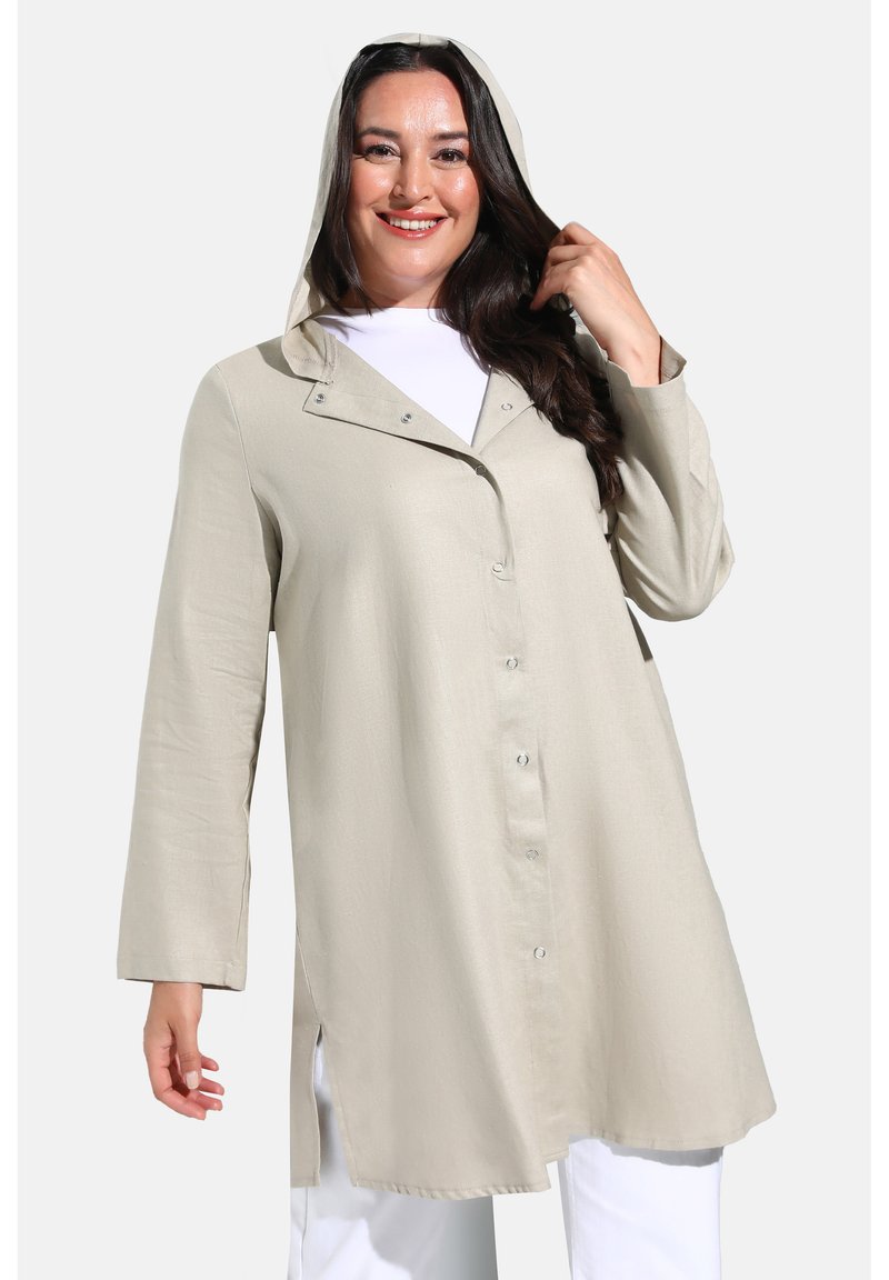 Light beige hooded jacket made of a smooth fabric. Features a button-up front, long sleeves, and side slits for added comfort.