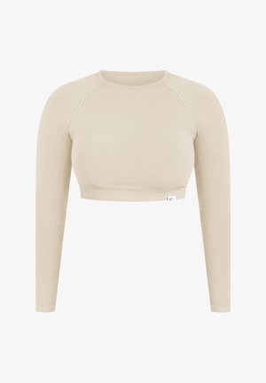 Lichtbeige lange mouwen crop top van zachte stof, met een ronde halslijn en raglanmouwen met een aansluitende zoom.