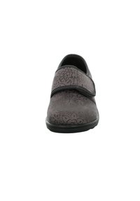 Gray slip-on shoe with floral embossed pattern, adjustable strap across the instep, and round toe. Textured surface, rubber sole.
