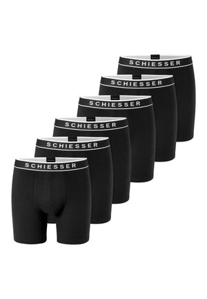 Zes paar zwarte herenboxers met witte taillebanden met het label "SCHIESSER", weergegeven in een verspringende rij op een witte achtergrond.