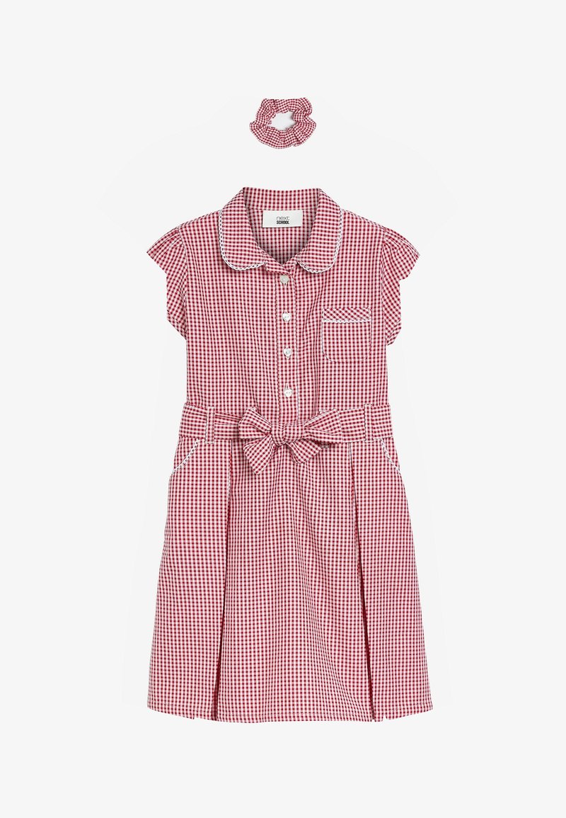 Robe à carreaux rouges et blancs avec des manches courtes, fermeture à boutons sur le devant, poche et ceinture assortie. Inclut un accessoire scrunchie.