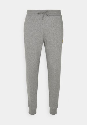 Slim-fit grey sweatpants with a drawstring waist and elastic cuffs, featuring a small yellow logo on the right thigh.