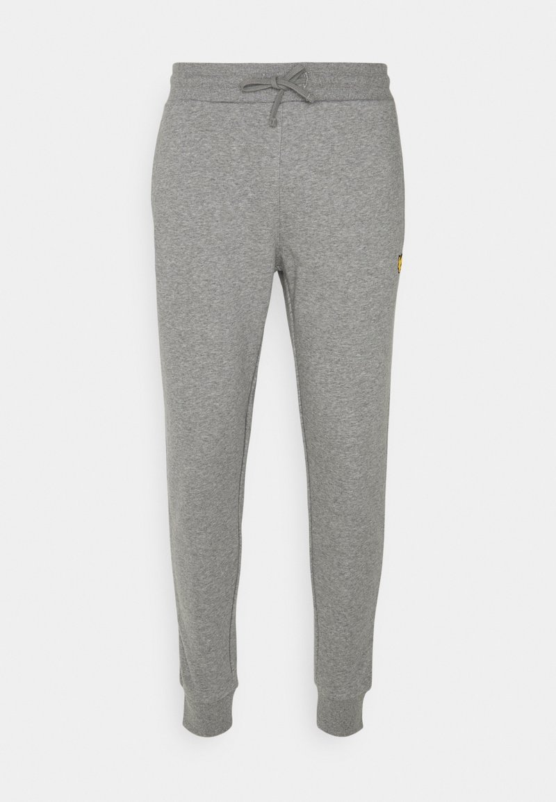 Schmal geschnittene graue Jogginghosen mit einem Kordelzugbund und elastischen Bündchen, mit einem kleinen gelben Logo auf dem rechten Oberschenkel.