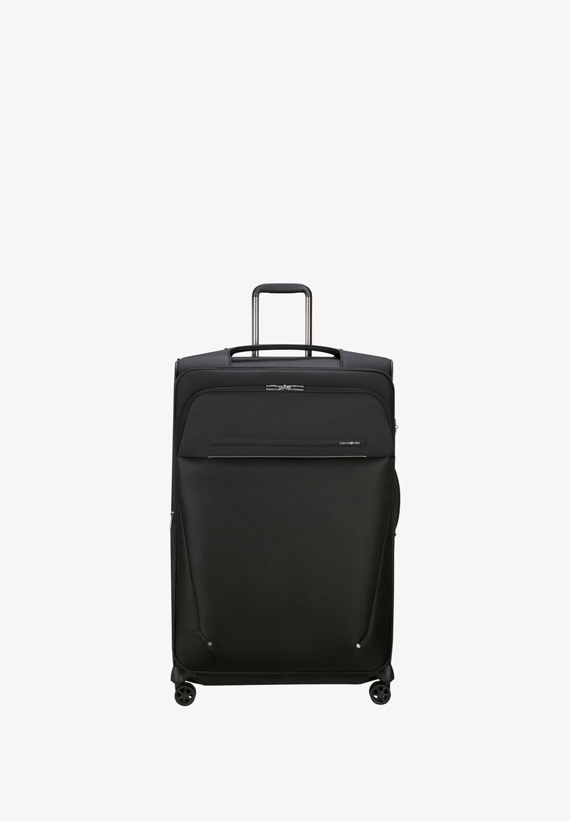 Black soft-shell suitcase with a retractable handle, smooth wheels, and zippered compartments. Features a front pocket and logo detailing.