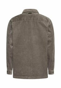 Grå manchetjakke i kordfløjl med lodret ribbet tekstur, knaplukning ved ærmerne og en krave. Set bagfra viser jakken et lige snit.