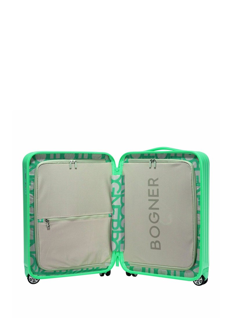 Grüner Hartschalenkoffer mit einem gemusterten Innenraum. Verfügt über Netzfächer und ein Logo. Sanfte Rollen für Mobilität.