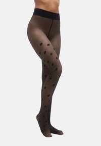 Collants noirs transparents à gros pois noirs, dotés d'une large ceinture noire et d'une finition lisse.