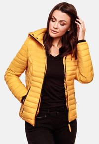 Yellow padded jacket with a hood, featuring a zip front, side pockets, and black accents on cuffs and zipper. Textured, quilted design.