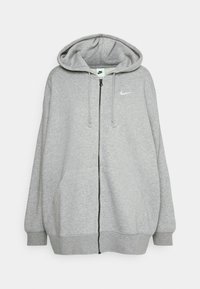 Haut à capuche zippé gris en doux tissu polaire. Il comporte une capuche spacieuse, des cordons de serrage et un petit logo blanc sur la poitrine.