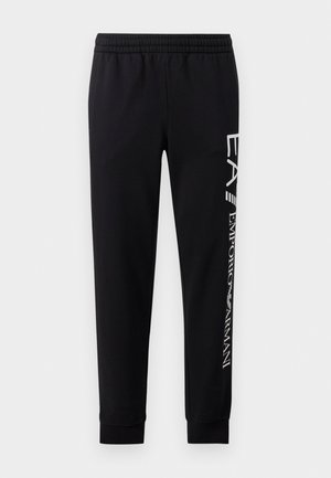 Schwarze Sweatpants aus Baumwollmischung mit elastischem Taillenbund, schmal zulaufenden Beinen, gerippten Bündchen und weißem Logo-Druck entlang der Seite.