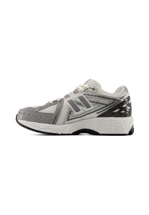 White and gray athletic running shoe with mesh upper, reflective details, lace-up closure, and thick cushioned sole shown from the side.