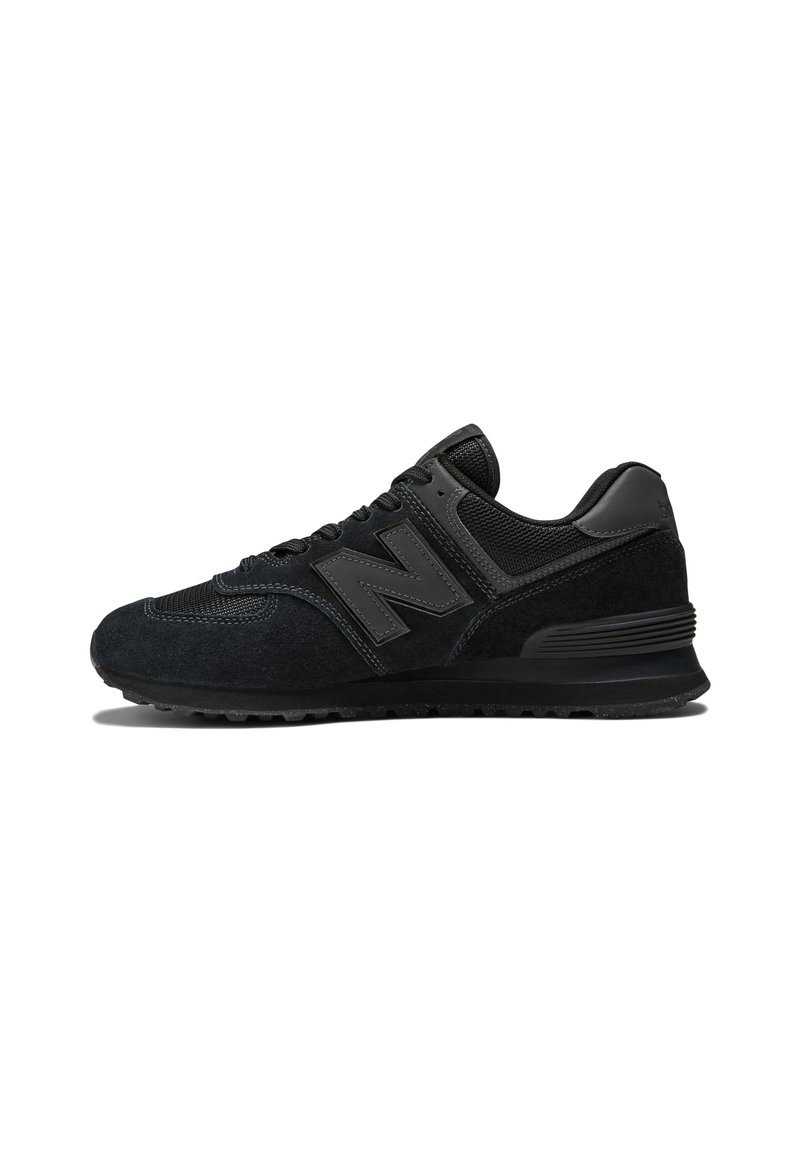 Black sneaker featuring a suede and mesh upper, thick sole, and prominent 'N' logo on the side. Textured design with lace closure.
