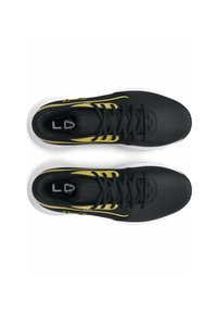 Black athletic shoes with yellow accents and white soles. Textured material, rounded toe, and traditional lacing system are visible.