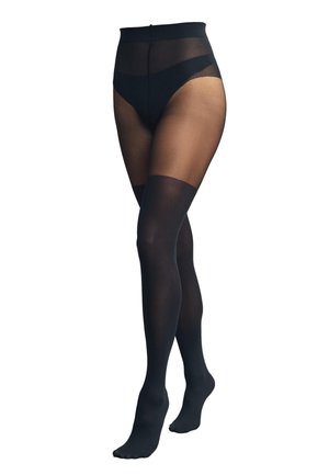 Doorschijnende zwarte panty's met verstevigde hoge taille en ondoorzichtige dijlange delen op gekruiste benen tegen een witte achtergrond.