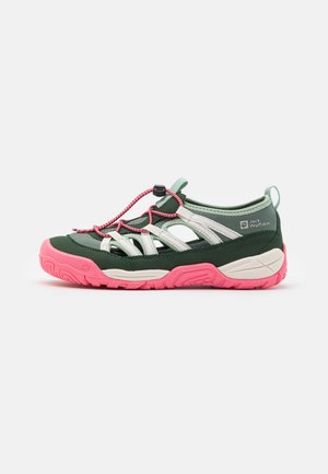 Green outdoor shoe with pink outsole and grey accents. Features a mesh upper, elastic laces, and a rubber sole for grip.