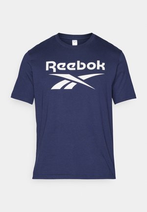 Navy blue cotton t-shirt featuring a prominent white Reebok logo and design accents. Round neck, short sleeves, smooth texture.
