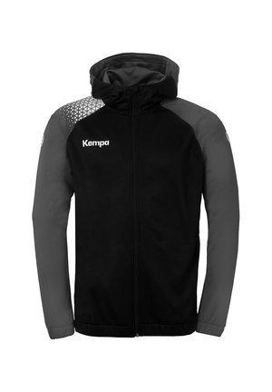 Black hooded jacket with gray sleeves, featuring a geometric pattern on one shoulder and a full front zipper. Text: "Kempa" on the chest.