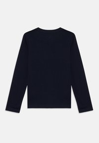 Long-sleeve shirt in navy blue cotton, featuring a crew neck, straight hem, and fitted silhouette. No visible patterns or accents.