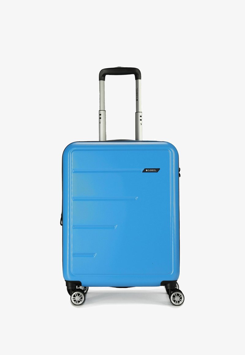 Blauwe harde koffer met een gestructureerd oppervlak, uitschuifbare handgreep en vier zwarte wielen. Heeft horizontale lijnen en branding aan de zijkant.