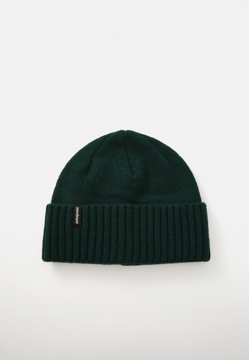 Green knitted beanie hat with a folded ribbed cuff and a small black logo label. Soft texture, rounded top shape, simple design.