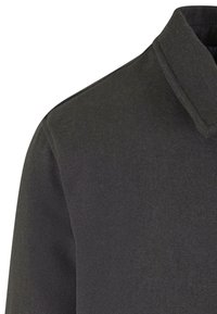Black wool jacket with a structured collar and smooth texture. The fabric appears warm and durable, featuring clean lines without embellishments.