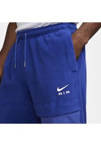 Nike Sportswear AIR WINTER PANT - Cargo trousers - deep royal blue/white