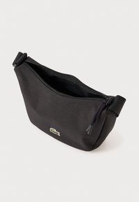 Black fabric bag with a zip closure, featuring a textured surface and a small embroidered logo on the front. Compact and simple design.