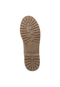 Bruine rubberen zool van een laars met diepe profielpatronen, maat 39, en het logo van het merk "Travelin'" gecentreerd op een witte achtergrond.