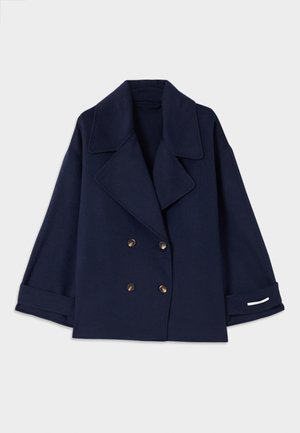 Navy blue double-breasted coat with a notched collar, gold buttons, wide sleeves, and cuff detailing in white. Made from a smooth fabric.