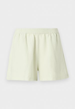 Pantalones cortos de cintura elástica color beige claro, de corte holgado y diseño liso, mostrados sobre un fondo blanco.